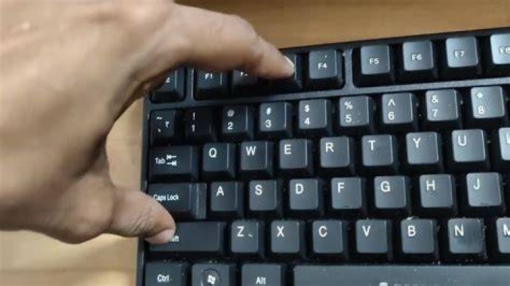 Which key enables you to type a letter in uppercase?